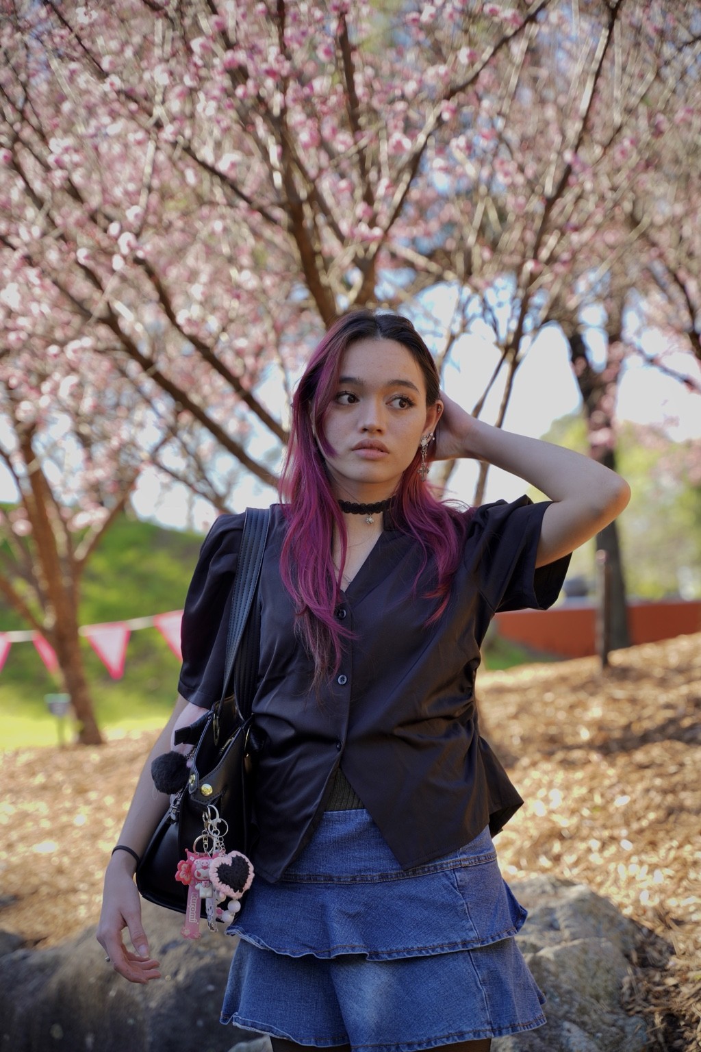 Natural-light portrait beneath flowering trees