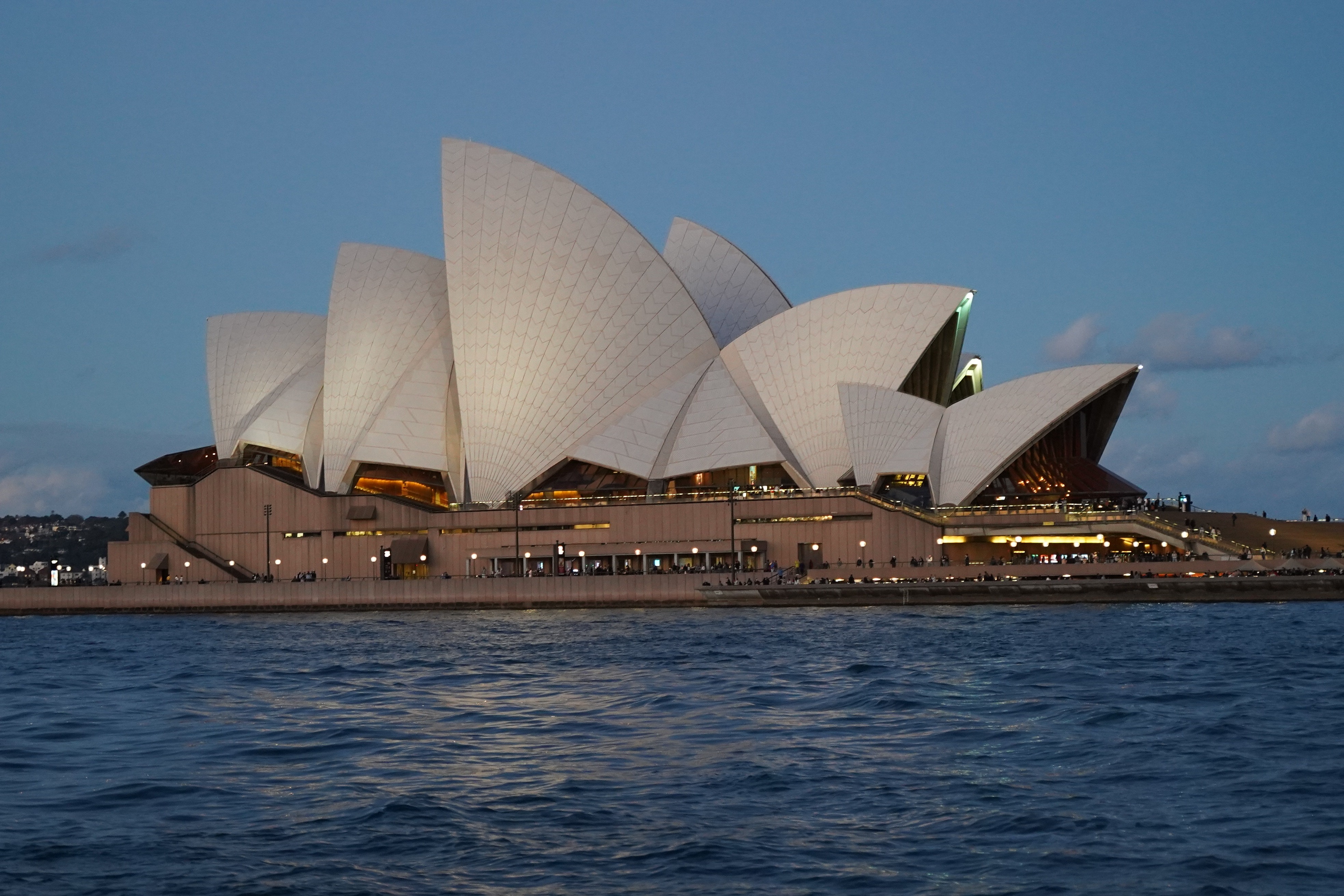 Sydney Opera House across the harbour in evening light